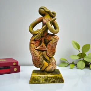 Handmade terracotta tribal musician figurine playing a flute, crafted from natural clay with earthy tones, displayed as boho ethnic home décor.